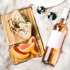 Photo of Custom Engraved Aesthetic ChopValue Charcuterie Board with food, wine and sunglasses